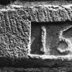 Detail of carved date stone.