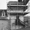 View of tower under scaffolding from NW.