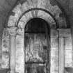 Interior.
S porch, inner end, detail of Romanesque doorway with nookshafts and cushion capitals.