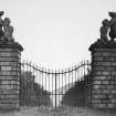 View through gates towards house.
