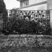 Detail of dwarf wall and ironwork to SE of projecting entrance bay.