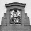 Detail of heraldic panel over main entrance.