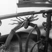 Interior.
Entrance stair hall, detail of stair ironwork with frog and insect motif.