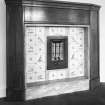 Interior.
First floor, master bedroom, detail of fireplace with original electric fire and tiled surround.