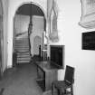 Interior. 
View of entrance lobby from S showing memorials and gallery stairs.