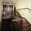 Interior.
View of workers' staircase from first floor half landing.