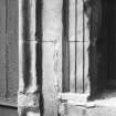 Detail of central doorway rybats, bolection moulded surround and remains of window sill.