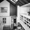 Interior. 
Elevated view from stair, overlooking baking area at ground floor level and pie-crust gallery to right.