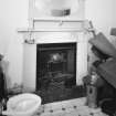 Interior. 
Detail of fireplace and toilet seat in upstairs room.