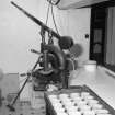 Interior. 
Detail of Scotch pie crust moulding machine in the pie-crust gallery with a tray of completed crusts.