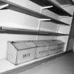 Interior. 
Detail of storage boxes in the bakery shop.