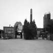 Alloa, Whins Road, Brewery
General view from E showing from left to right, brewhouse, brewhouse pend with mill room intake and distribution area above, chimney and spent grain silo. The spent grain silo takes the grain from the lauter tun in the brewhouse and is used as cattle feed