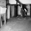 Alloa, Whins Road, Brewery, Barns Block, ground floor, interior
View of dust extractor, grain elevator (1996 - showing buckets) and part of the malt handling system. The dust from the grain is drawn by a vacuum through the extractor into 'socks' whose contents are then emptied into collection bags for disposal



