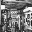 Interior. 
View of Coffey Still in Still House.