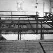 Interior.
View of wooden-topped cast-iron spirit receiver tanks.