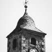 View of clock and spire on steeple.