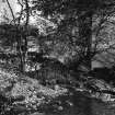 View of remains of lade and wheel housing on W wall.