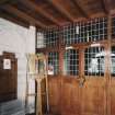 Interior. View of entrance porch showing glazed screen and tower stair door