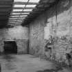 Interior.  View from SW in lean-to area at the NE side of the warehouse building ('Room 4')