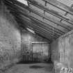 Interior. View from SW at NE end of lean-to area at NE side of warehouse ('Room 3')