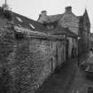 Oblique view from N along NW side of building, facing onto Scotland's Close