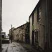 View of lane from SW along Scotland's Close, showing NE side of building