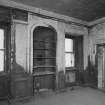Interior.  Detailed view from NW showing mouldings and panelling of 1st fl room in warehouse ('Room 10')