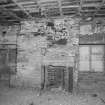 Interior. Detailed view of fireplace at NE end of 1st floor in warehouse ('Room 10')