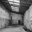 Interior. View from NE of SE end of lean-to area at NE side of warehouse ('Room 4')