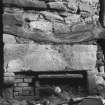 Detail of fireplace and beam in exposed SW wall.