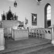 Interior. View of platform area with pulpit and communion table