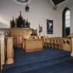 Interior. View of platform area with pulpit and communion table