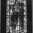 Interior. View of stained glass window of St Peter