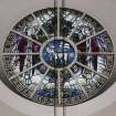 Interior. View of circular stained glass window of The Lamb of God