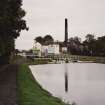 View of distillery from canal towpath to west