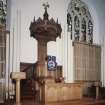 Interior. View of chancel from SW showing pulpit, font, communion table and lecturn