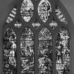 Interior. N wall W  stained glass window depicting the Good Samaritan by Christopher Whall 1896