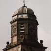 Detail of upper stages of clock tower from E.