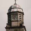 Detail of upper stages of clock tower from S.