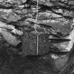 Detail of roof weight on S building.