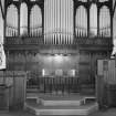 Interior. View of pulpit,organ,communion table and screens from NE