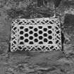 Detail of typical ornate cast-iron wall vent in outside wall of former Weaving Shed (building B1).