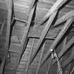 Interior.
E outbuilding, detail of roof structure.
