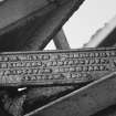 Detail of canopy manufacturer's nameplate.