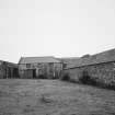 View of steading buildings adjacent to farmhouse from ESE.