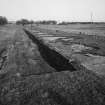 View from SW of foundations of lobby of former Quinan stove or drying house, used to dry nitrocotton.  Most of the 36 Quinan stoves at Eastriggs have been demolished, leaving foundations similar to those shown here.