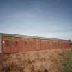 View from SE of surviving Quinan stove or drying house, building R19, latterly converted to a narrow-gauge transit shed.