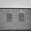 Detailed view from E of window openings on E side of Quinan stove or drying house, building R19, latterly converted to a narrow-gauge transit shed.