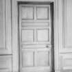 Interior.
Principal floor, room N of drawing room, E wall, detail of panelled door with brass lock.