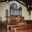 Interior.
View of Communion table and pulpit with organ behind from WNW.